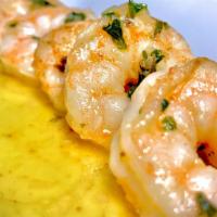 Camarones En Ajillo (8 Und) · Shrimp in our garlic olive oil and white wine sprinkled with chili flakes.