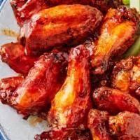 Chicken Wings · Cooked wings of a chicken coated in sauce or seasoning. your choice of flavor.