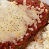 Steak Parmegiana · A tender breaded steak covered with our signature homemade tangy red sauce topped off with m...