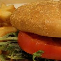 Veggie Burger (V) · Vegan veggie patty grilled and served on a bun with lettuce & tomato.