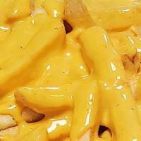 Cheese Fries · Golden crisp French fries topped with liquid cheese