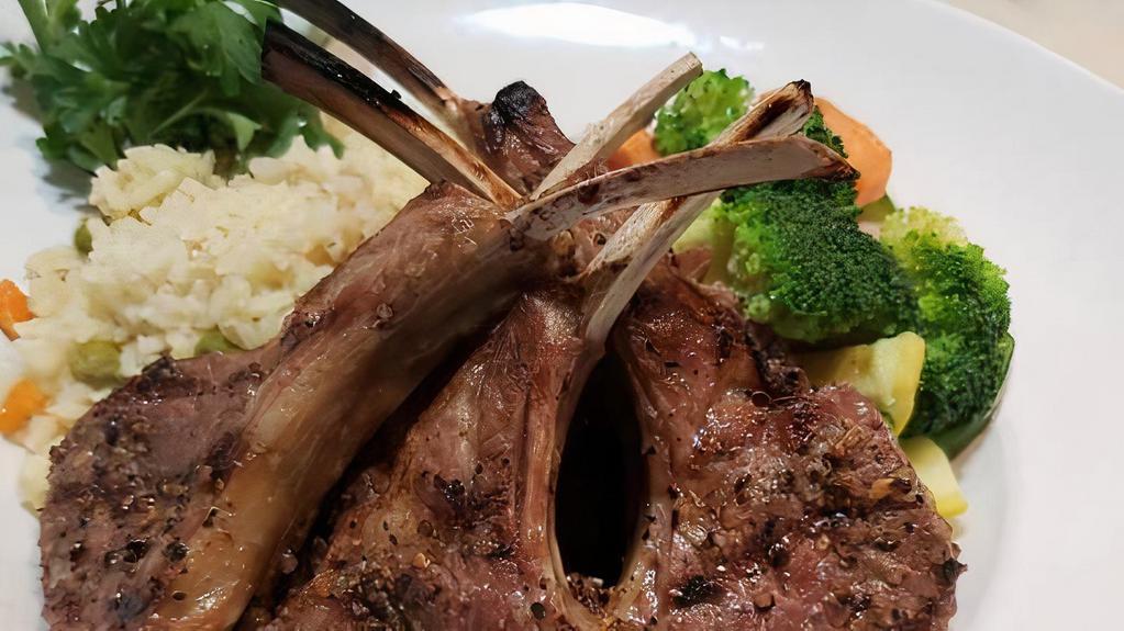 Grilled Lamb Chops · 6 grass fed New Zealand lamb chops served with rice pilaf and mixed vegetables