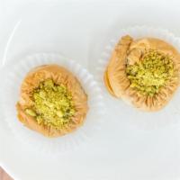 Bracelet Pistachio · Fillo dough, pistachio, sugar butter ghee, and simple syrup with blossom and rose water. 2  ...