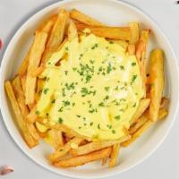 Cheese Fries · Idaho potato fries cooked until golden brown and garnished with salt and melted cheddar chee...