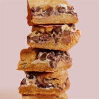 S'Mores Bars · Gooey marshmallow and chocolate chips layered between a buttery graham crust.