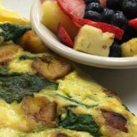 The Jamaican · This omelet is amazing. Filled with Jerk Chicken, plantain and spinach with a layer of Peppe...