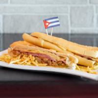 The Cuban · Lechon, ham, swiss cheese, pickles, mustard and mayo.