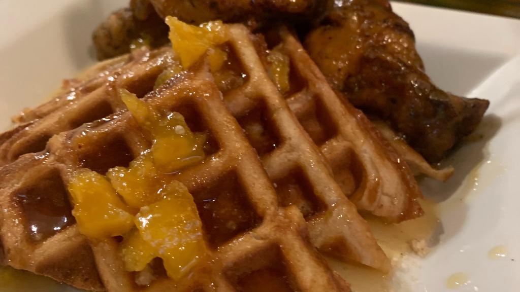 Chicken & Waffles · Marinated Chicken Breast Strips | Served with a Cinnamon Sugar Waffle.  Sample Cup of Taste The Peach Sauce Included.