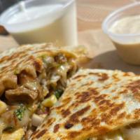 Kid'S Steak Quesadilla · Steak and cheese quesadilla. Served with tortilla chips, kid's beverage, and your choice of ...