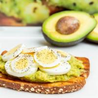 Protein Toast · Avocado paste, sliced eggs, black pepper, and olive oil.