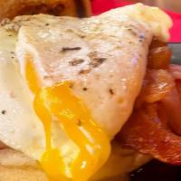 Sunny Kingsland Sandwich · Our signature sandwich, bacon, one sunny side up egg, american cheese, honey ham, and hashbr...