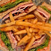 Osprey Club · Our traditional club sandwich with turkey, ham, bacon, tomato, lettuce, and mayonnaise. Serv...