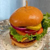 The Local Burger · 8oz burger with lettuce, tomato, and red onion on a brioche bun