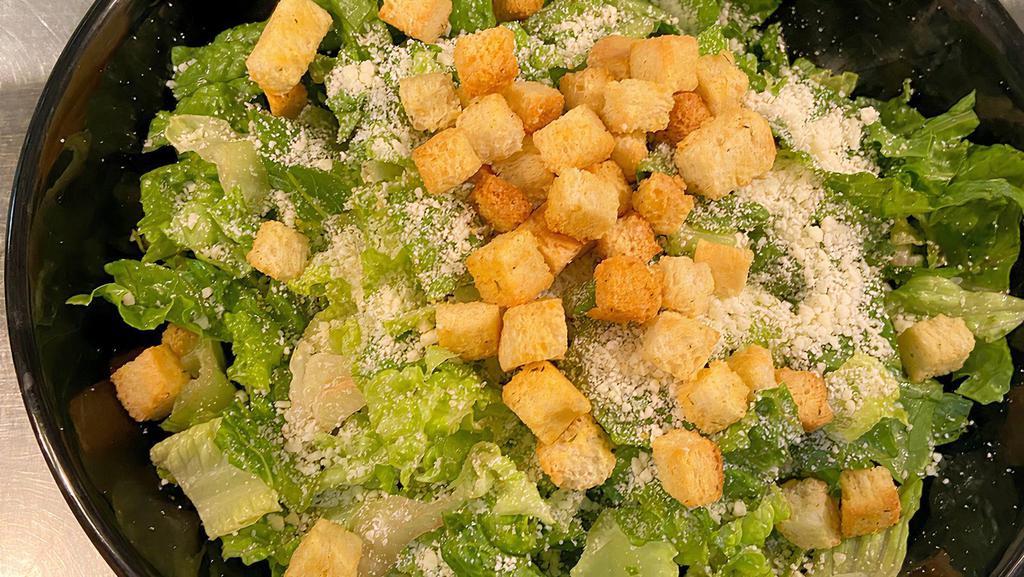 Caesar Salad · Romaine lettuce with grated parmesan cheese, toasted croutons, and our house made caesar dressing.