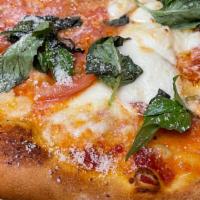 Margherita Pizza · Fresh mozzarella, fresh tomatoes, sauce, olive oil, basil, oregano