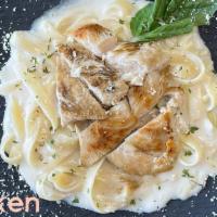 Fettuccine Alfredo With Chicken · Includes three garlic rolls