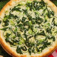 Tomato And Spinach White Pizza · Gourmet white pizza with spinach, tomatoes, ricotta, mozzarella, and fresh garlic on thin cr...