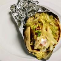 Falafel Gyro Wrap · Three falafel balls wrapped in pita bread with hummus, lettuce, red onions, tomatoes, and to...