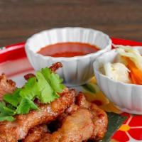 Pork Jerky · A marinated strip of pork in special ingredient, serve with spicy sauce.