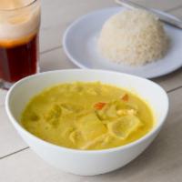 Yellow Curry · A traditional golden thai curry simmered in coconut milk with onion, potato, pineapples, and...