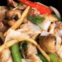 Pad Kee Mao · The classic drunken noodles. Stir-fried fresh flat rice noodles with spicy herbs, bell peppe...