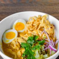Khao Soy · Our signature northern Thai curry; egg noodles, coconut milk, yellow curry, stewed chicken, ...
