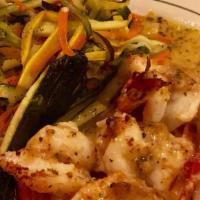 Shrimp Scampi · Served over linguini with a side of dinner rolls.