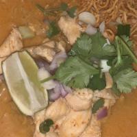 Khao Soi · Spicy. Egg noodles with chicken in tasty coconut curry, sprinkled with chopped onion, cilant...
