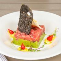 Tartare Di Tonno · Diced tuna, avocado, capers, red onions, truffle oil, and ginger-soy reduction.