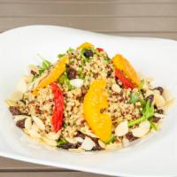 Quinoa Salad · Tri-color quinoa, arugula, sundried tomato, raisins, almonds, orange, lemon dressing, and ba...