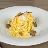 Tagliolini Cacio E Pepe & Black Truffle · Fresh tagliolini pasta, Pecorino cheese, sliced black truffle, and fresh black pepper.