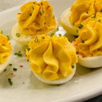 Deviled Eggs · deviled eggs with paprika and chives