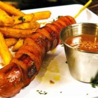 Kids Curly Beef Dog Stix · Includes a sauce and side.