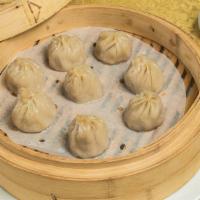 Shanghainese Dumplings · Handmade daily in our kitchen. Eight bamboo steamed Shanghainese soup dumplings filled with ...