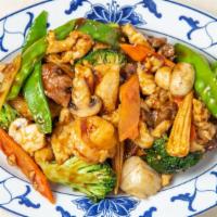 Happy Family · Fresh shrimp, scallop, chicken and beef sauteed with mixed vegetables in chef's special brow...