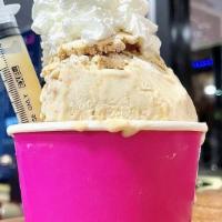 Tres Leches · Ice cake batter, dulce de leche, cake, whip cream, and a condensed milk syringe.