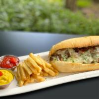 Philly Cheesesteak · Toasted homemade hoagie bun bread, simple combination of thin slices of top sirloin, ribeye ...
