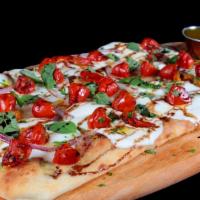 Flatbread Pizza · Fresh mozzarella cheese, cherry tomatoes, fresh basil, reduced balsamic vinaigrette, EVOO on...