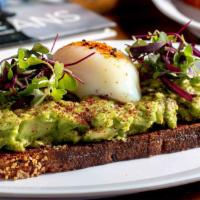 Avocado Toast · Zak the baker multigrain bread, Hass Avocado, Mixed greens, poached egg, miso vinaigrette an...