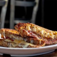 Grilled Cheese With A Bag Of Chips · A blend of brie, Colby, Monterey and Sharp Cheddar melted on the griddle on Zak the baker mu...