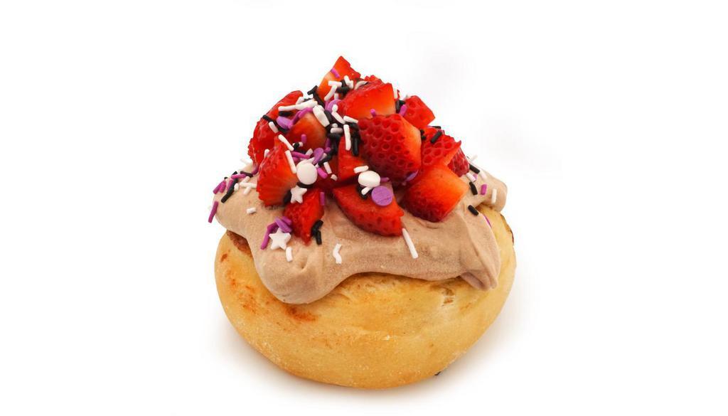 *Sparkle Berry Roll · chocolate frosting topped with sprinkles and fresh strawberries (sprinkle colors may vary)
