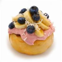 Tropical Bliss Roll · Raspberry frosting topped with fresh bananas, blueberries and coconut