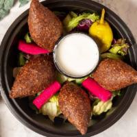 Fried Kibbe App · Mediterranean meatballs stuffed with onions and spices fried, served with side of yogurt.