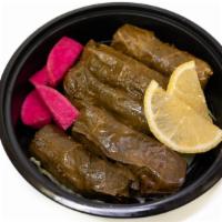 Vegetarian Grape Leaves App · Rolled grape leaves stuffed with rice, chickpeas, onions, and tomatoes cooked in fresh lemon...