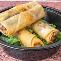 Meat Rolls App · Ground beef and lamb wrapped in filo dough and fried.