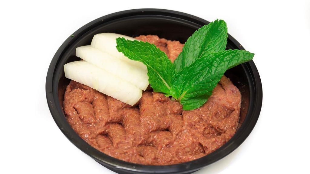 Kibbe Nayeh App · Raw ground beef mixed with Lebanese spices, minced onion, and fine burghul.