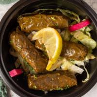 Veggie Grape Leaves Dinner · Rolled grape leaves stuffed with rice, chickpeas, onions, and tomatoes cooked in fresh lemon.
