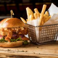 Fried Chicken Sandwich · Fried chicken breast, toast in hot sauce, lettuce, tomato, onion, Mozzarella cheese and ranc...