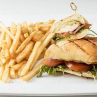 Champions Chicken Panini · Grilled chicken breast, pesto, arugula, tomato, onion, Mozzarella cheese with fries.