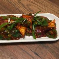 Dry Paneer Chilli · Batter fried paneer stir fried with chilies in a spicy-tangy sauce.